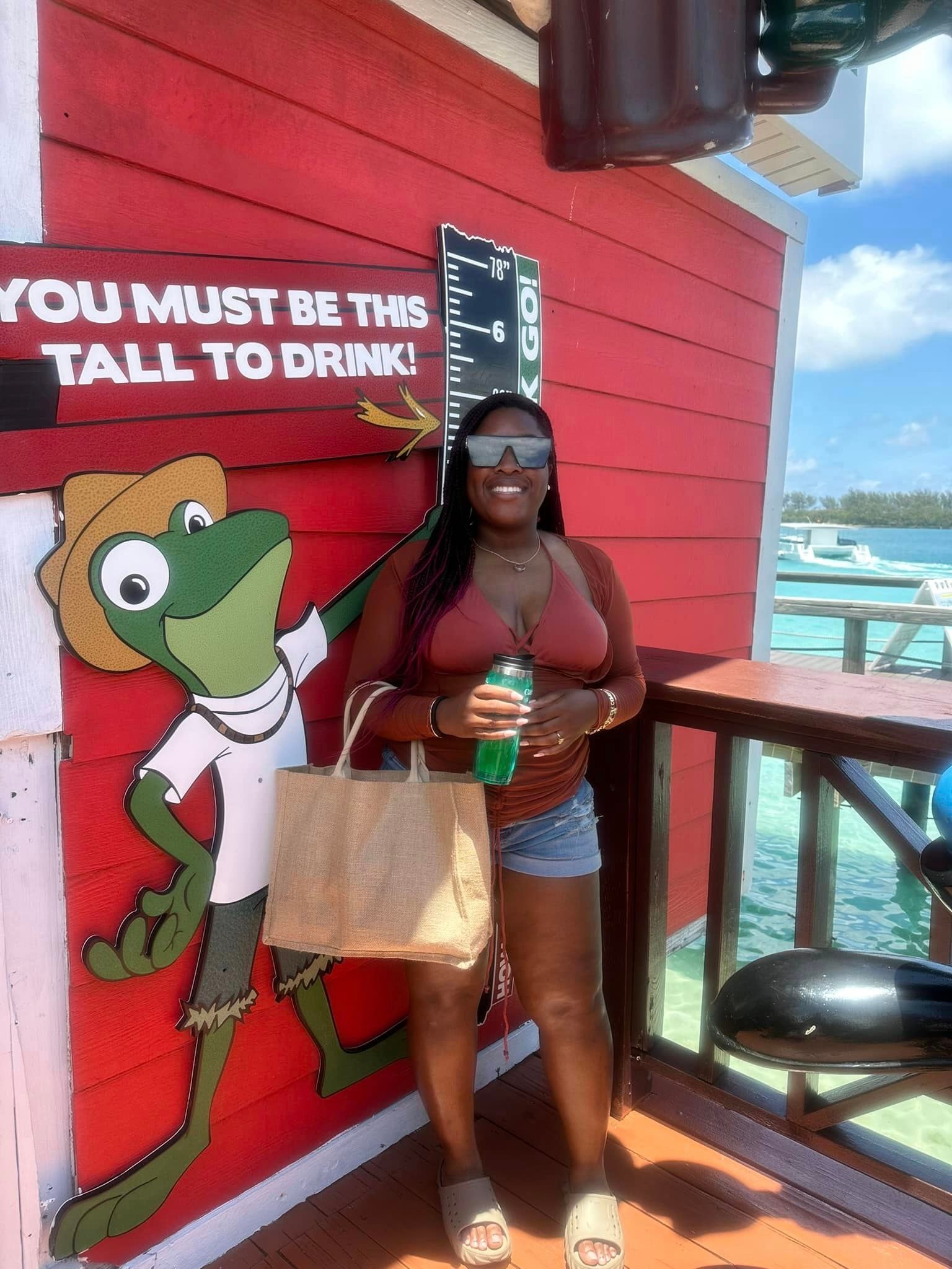 Woman posing at Bahamas waterfront bar