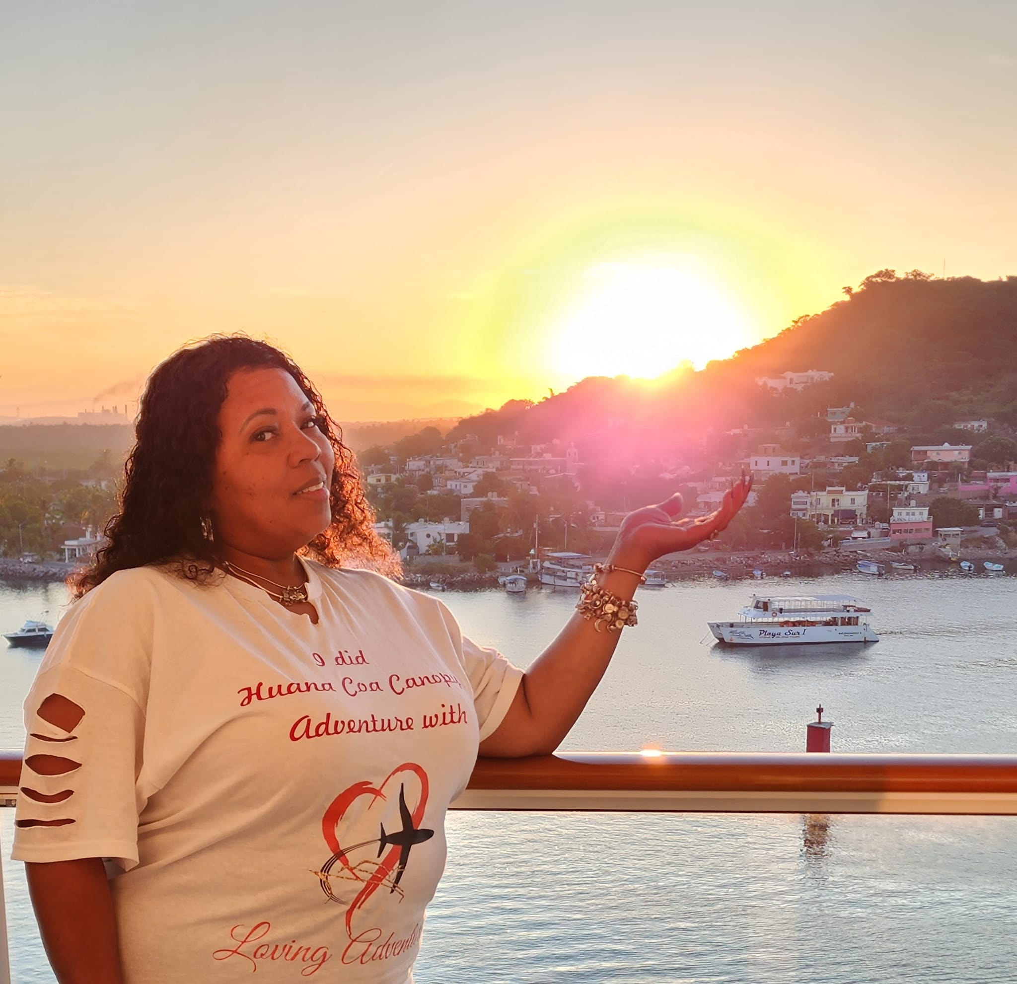 Ms. Mia catching the sun at sunset on a cruise ship balcony