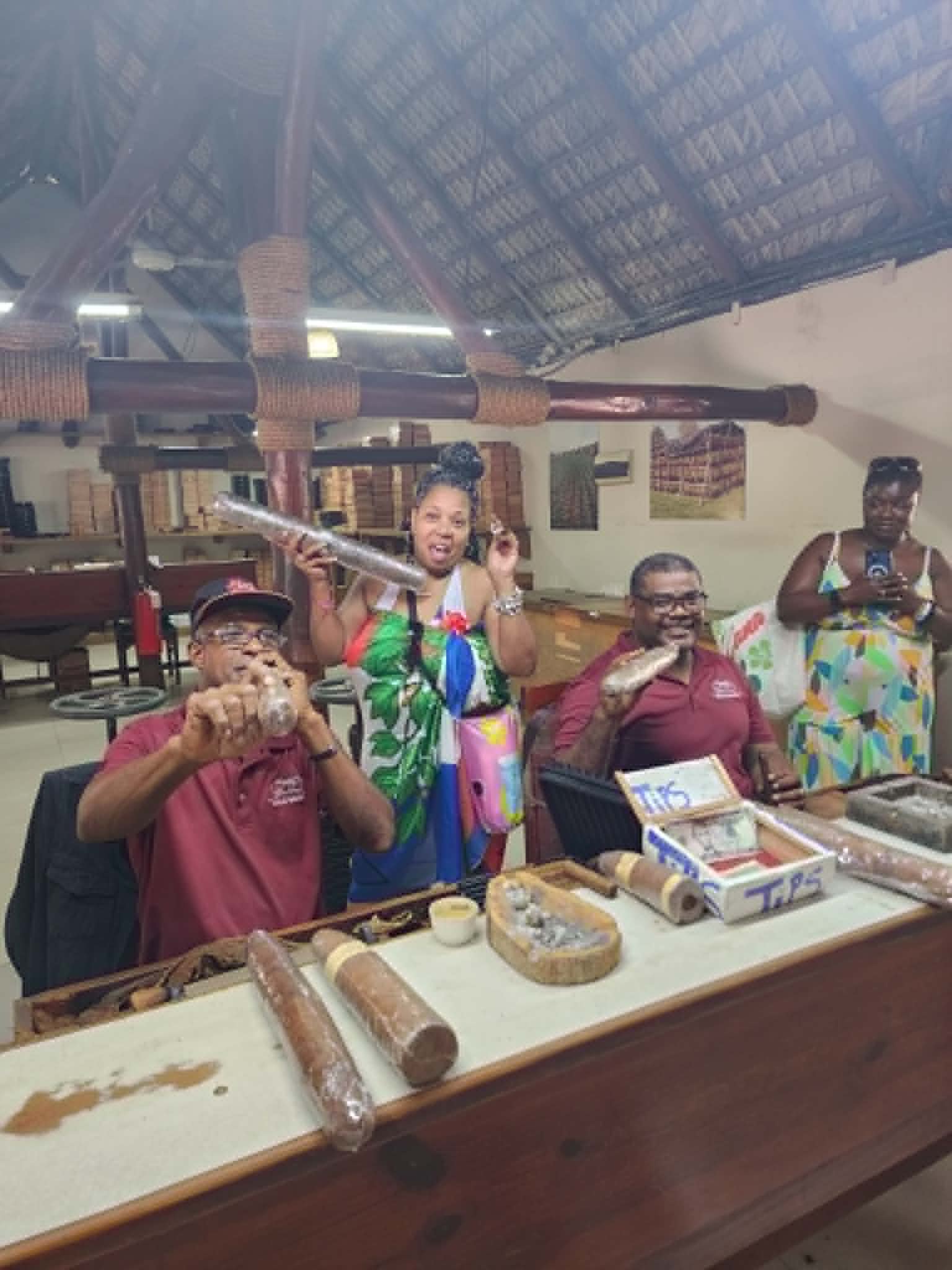 Group laughing during a cigar rolling excursion