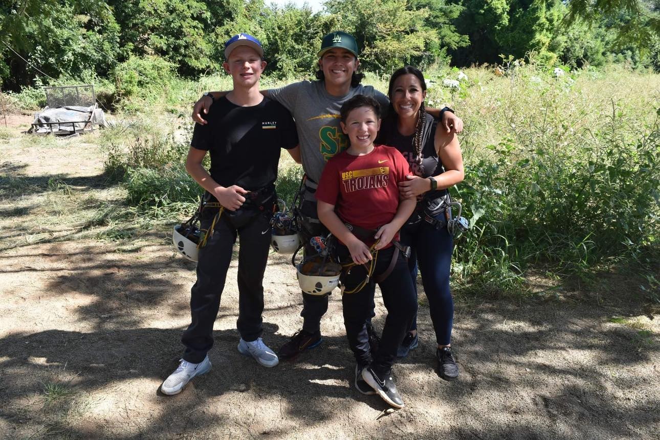 Family group photo after zip-lining adventure