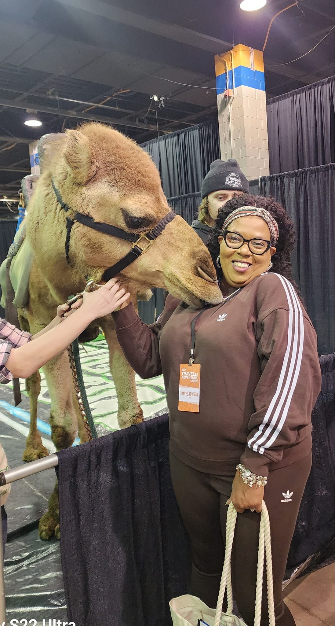 Mia with a camel at Travel Adventure Show