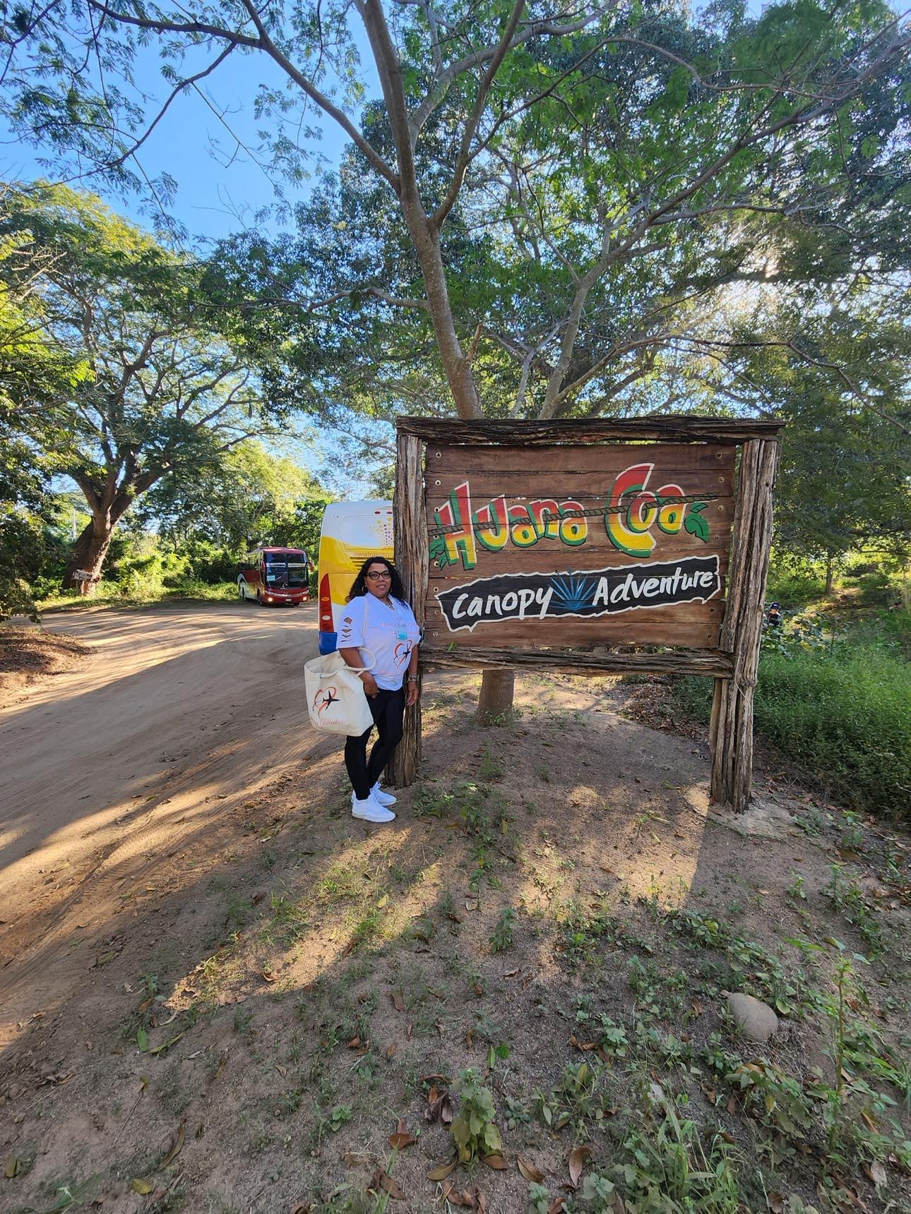 Mia at Huana Coa Canopy Adventure sign