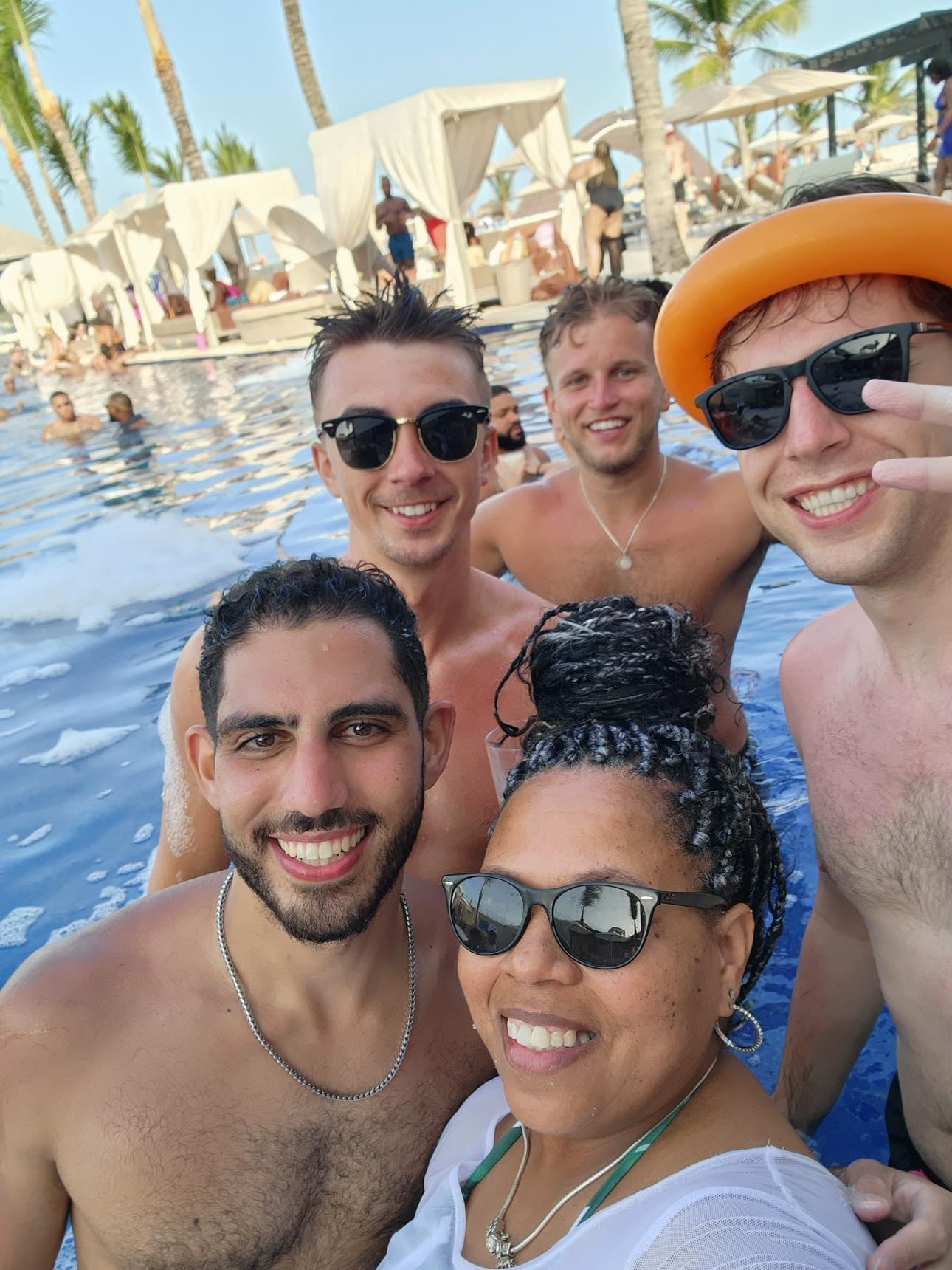Group of friends at resort pool party
