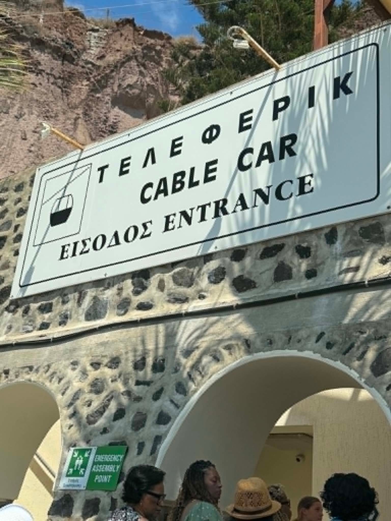 Cable car entrance sign in Santorini, Greece