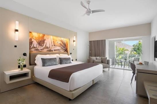 Luxury king suite with tropical artwork and balcony